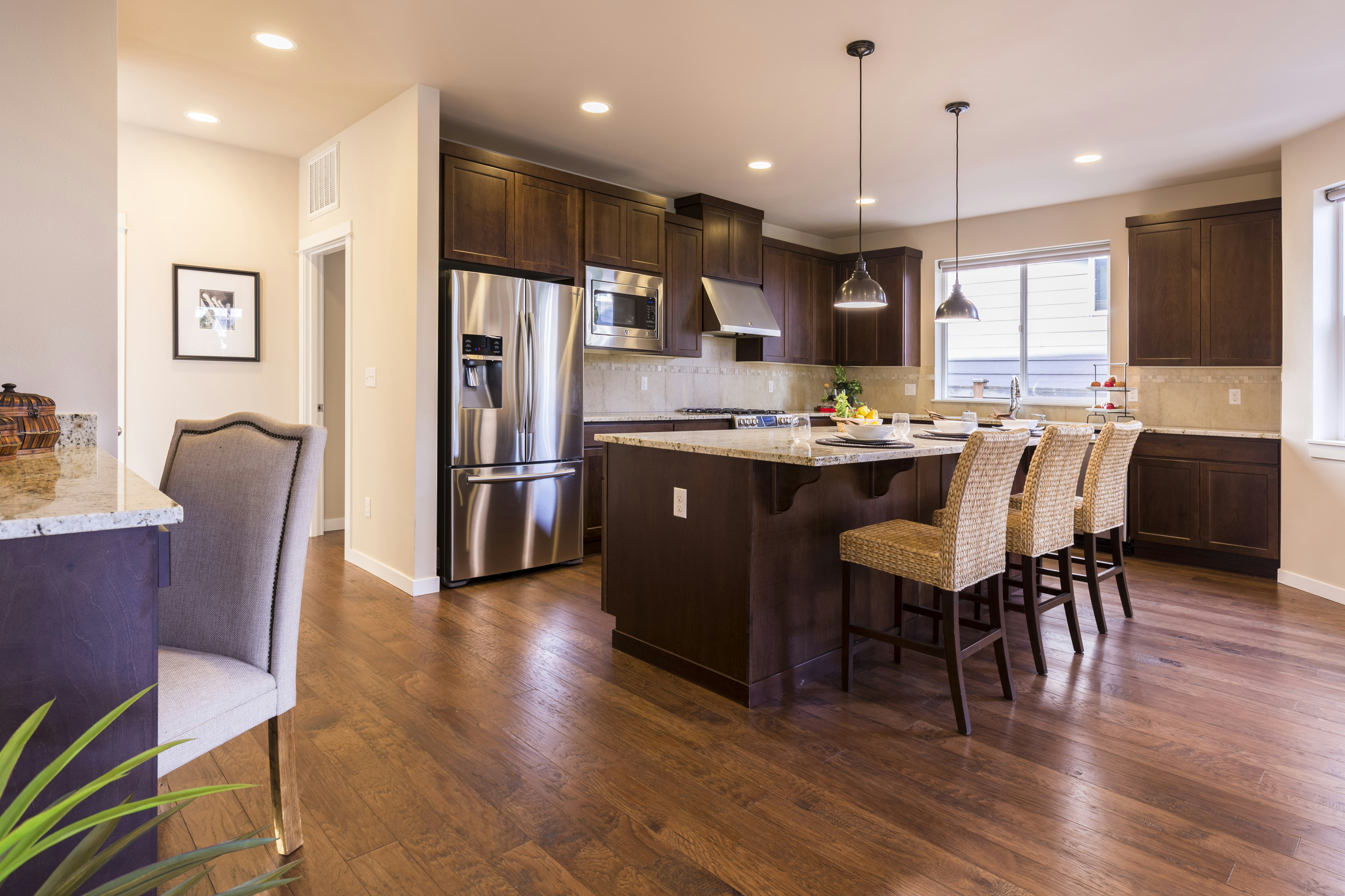 “Rich hardwood flooring with a smooth finish and distinct natural wood grain patterns.”